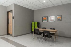 School Hallway with desk and washroom entrance