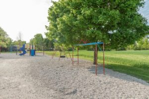 School playground with swings and slides